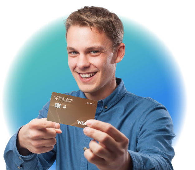 Joven catire sosteniendo en sus manos la tarjeta Visa Débito Empresarial contactless del Venezolano de Crédito